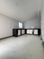 Bright modern kitchen with tiled backsplash and white cabinets