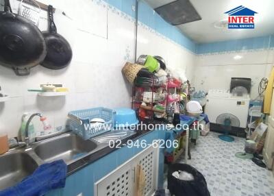 Modest kitchen with appliances and utensils