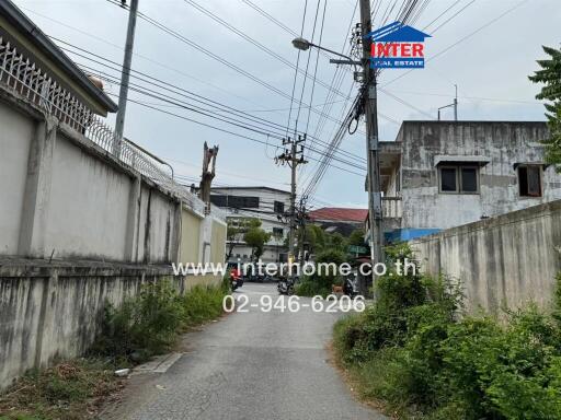 Exterior view of buildings along a narrow street