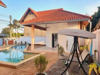 Backyard with a pool and patio