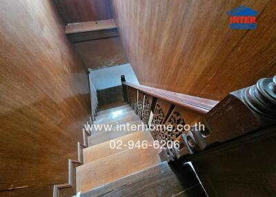 Wooden staircase with decorative railing