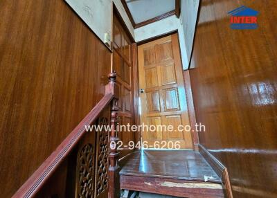 Wooden staircase and landing area
