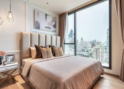 Modern bedroom with large window and city view