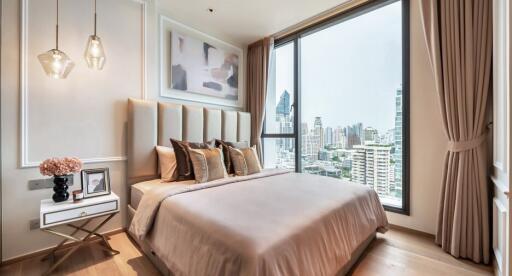 Modern bedroom with large window and city view