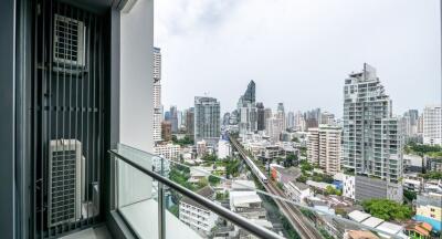 City view from apartment balcony