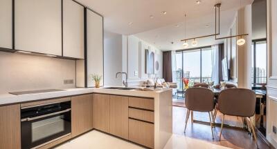 Modern kitchen and dining area with large windows and city view