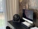 Small workspace setup in a bedroom with a computer