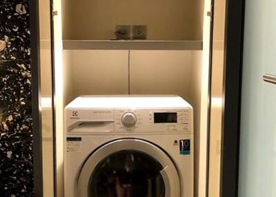 In-unit laundry with washer and shelf