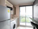 Modern kitchen with appliances and a large window