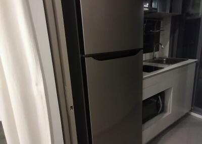 Modern kitchen with fridge and sink