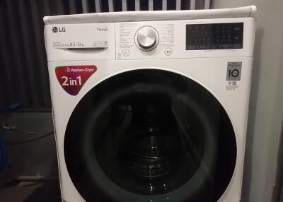 A high-efficiency washer-dryer in the laundry area