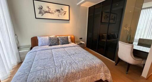 Spacious bedroom with modern decor and ample storage