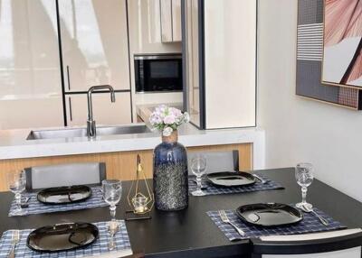 Modern dining area with a kitchen in the background