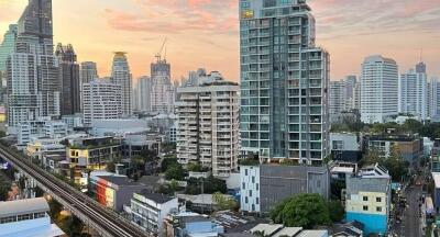 Aerial view of buildings at sunset