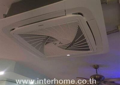 Ceiling with air conditioning unit and fan