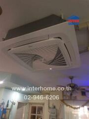 Ceiling with air conditioning unit and fan