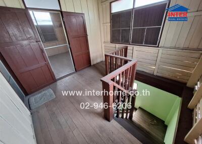 Staircase in a house with wooden floors and doors