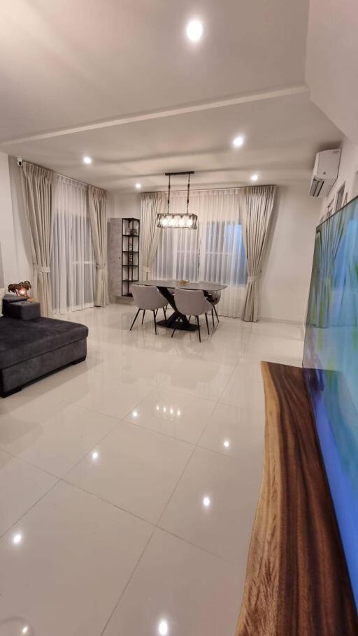 Spacious and modern living room with a dining area