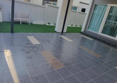 Covered outdoor patio with tiled floor