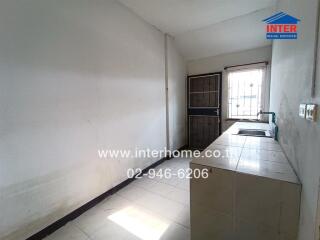 Simple kitchen with sink and tiled counter