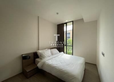 Modern bedroom with a double bed and large window