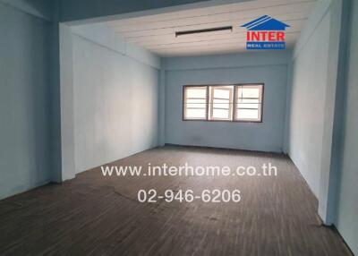 Unfurnished room with wooden floor and large windows