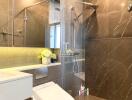 Modern bathroom with glass shower and decorative lighting