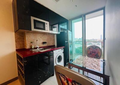 Small kitchen area with balcony view
