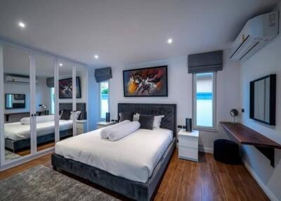 Modern bedroom with a large bed and contemporary decor