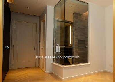 Modern interior space with wooden flooring and glass enclosure