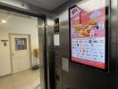 Elevator interior with digital advertising screen