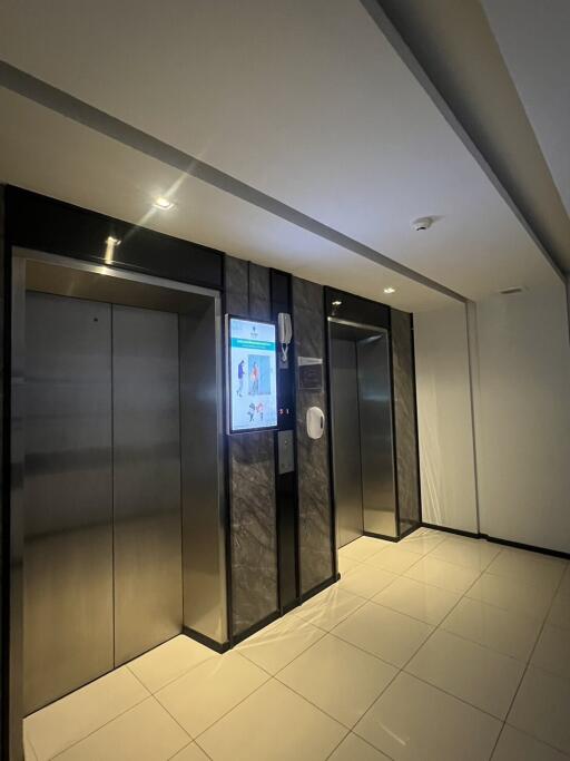 Modern building elevator lobby with two elevators