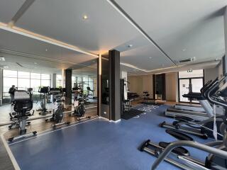 Modern fitness center with various exercise equipment