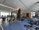 Modern fitness center with various exercise equipment