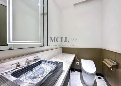 Modern bathroom with marble sink and toilet