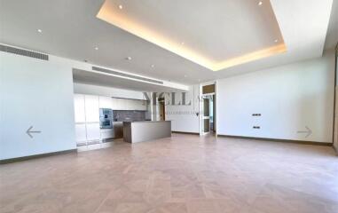 Spacious living room with modern kitchen area