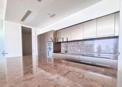 Modern kitchen with marble countertop and built-in appliances