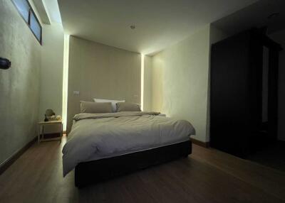 well-lit bedroom with minimalist decor
