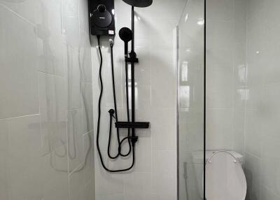 Modern bathroom with glass-enclosed shower and toilet