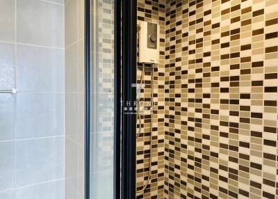 Shower area with modern tiles