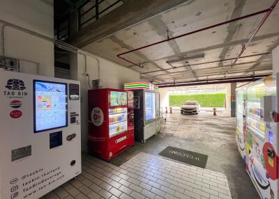Parking area with vending machines and a car