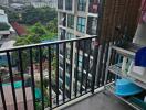 Balcony with a view of neighboring buildings and surrounding area