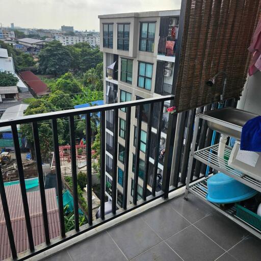 Balcony with a view of neighboring buildings and surrounding area