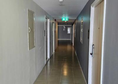 Hallway with doors and exit sign