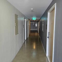 Hallway with doors and exit sign