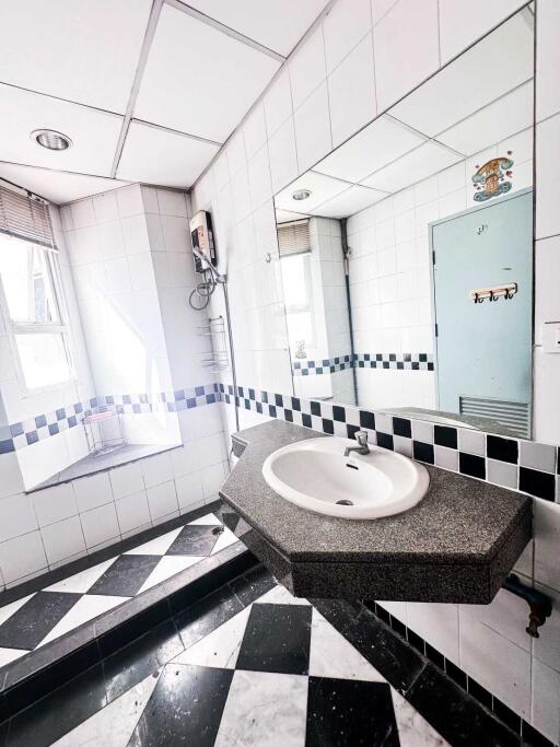 Modern bathroom with sink and large mirror