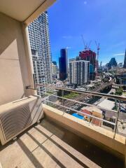 City view from a balcony with air conditioning unit