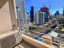 City view from a balcony with air conditioning unit