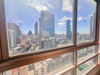 View of the cityscape from a high-rise building window