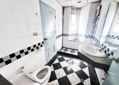 Modern bathroom with checkered black and white tiles
